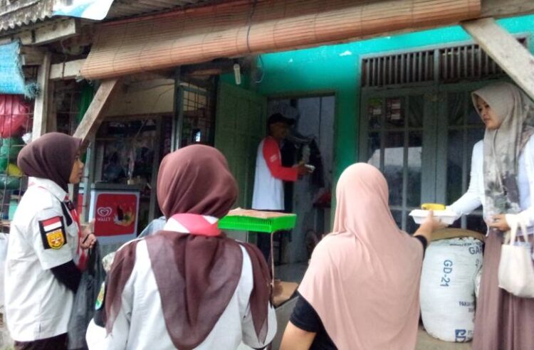 Pramuka Peduli Kwarran Ciawi Berbagi Makanan Untuk Lansia dan Dhuafa